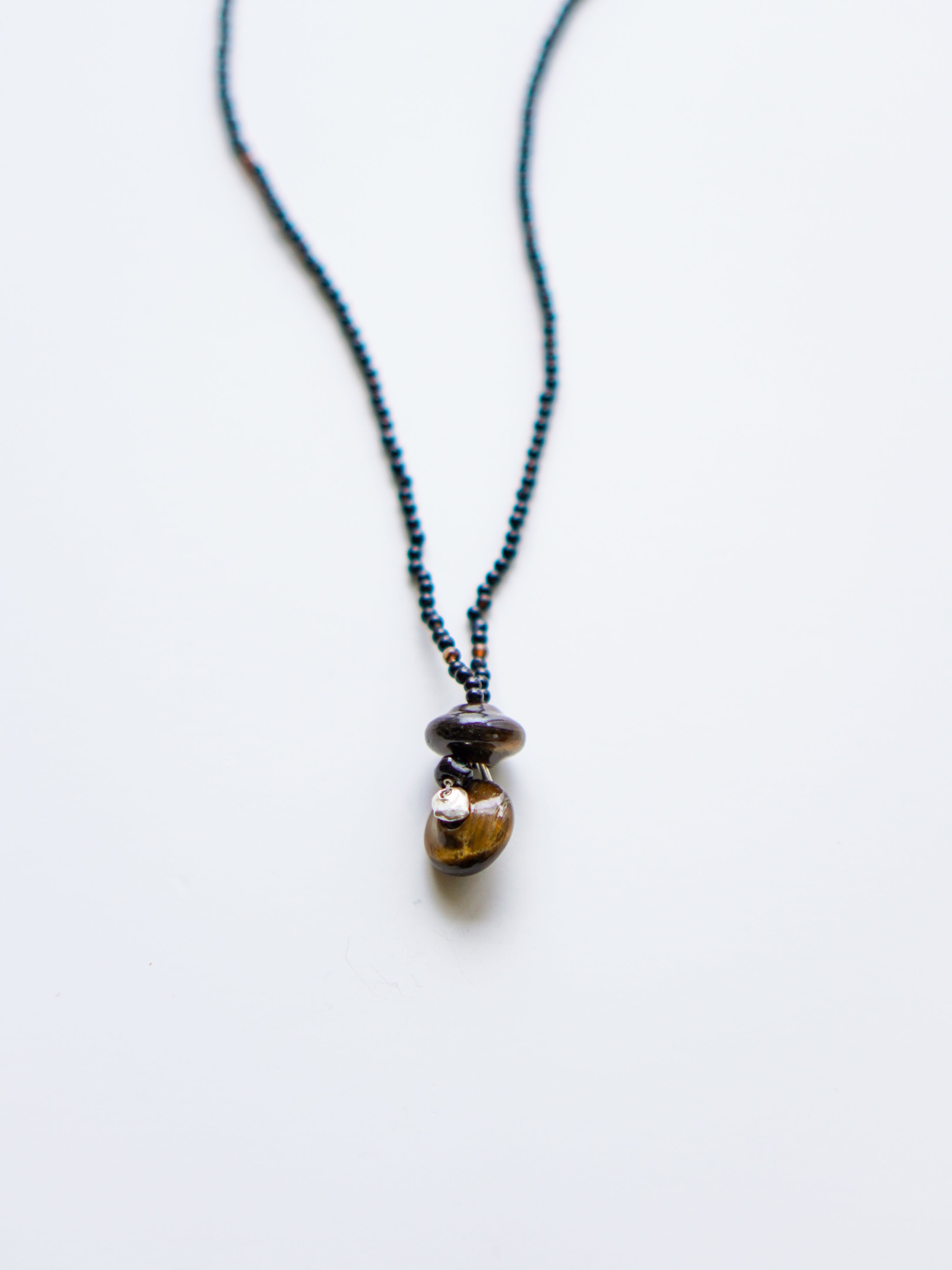"Spindle Wheel Twins"Necklace. c/# Tiger Eye
