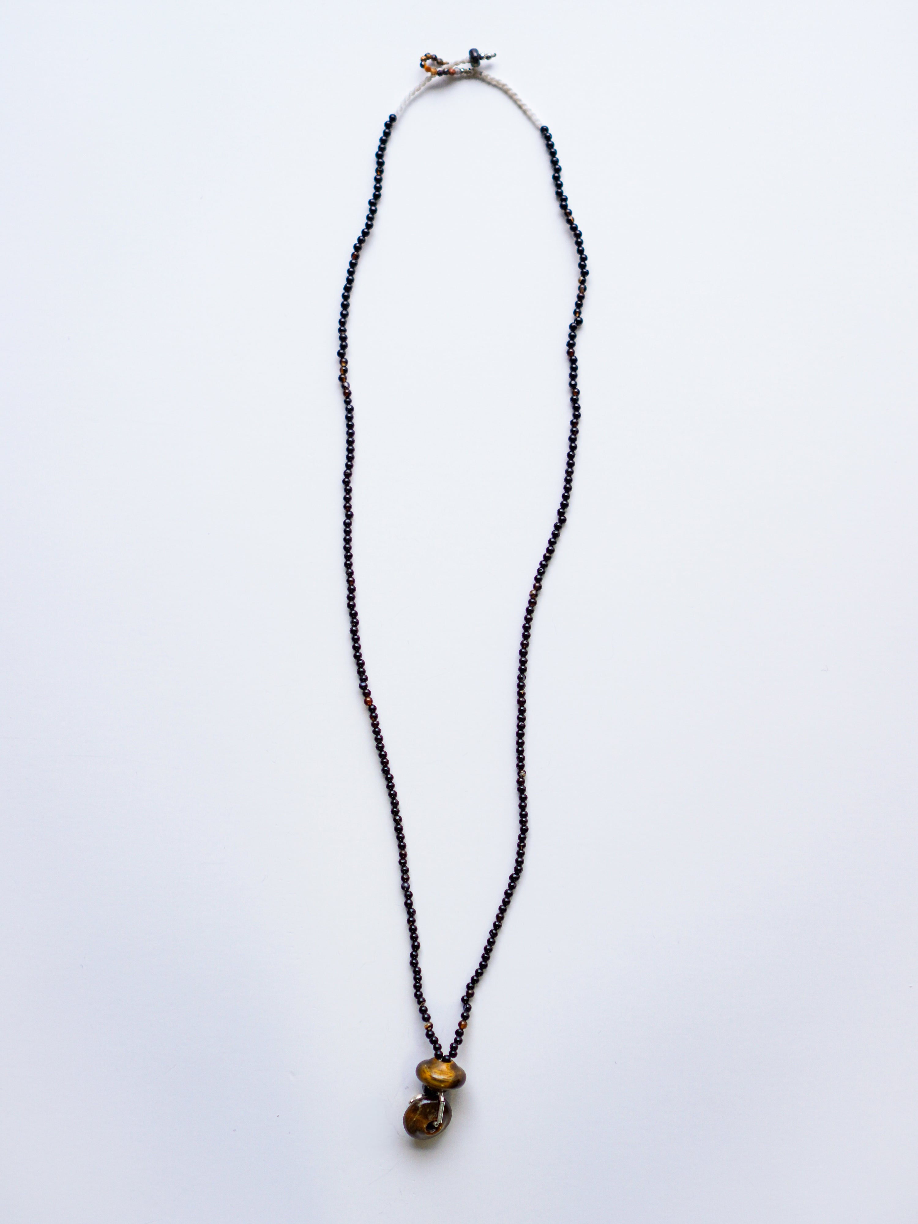 "Spindle Wheel Twins"Necklace. c/# Tiger Eye